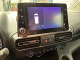 a picture of a car dashboard with a tablet on it