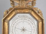 une image représentant une horloge avec un cadre doré et un cadran orné d'un oiseau