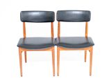 pair of mid century danish teak dining chairs with black leather upholstered seats