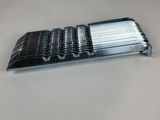 a close up of a metal object on a white surface
