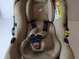 a baby car seat that is attached to the back of a stroller