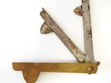 a pair of old tools that are on a shelf