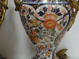two vases that are sitting on a table