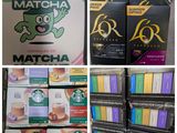 many boxes of coffee on display in a store