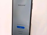 an image of a cell phone with a welcome screen displayed on it