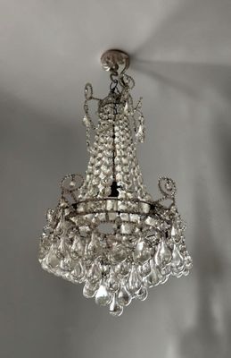 a close up of a crystal chandelier hanging from a ceiling