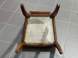 a chair that is sitting on a tile floor