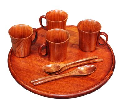 a wooden tray with cups and spoons on it