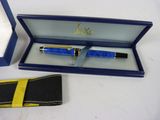 a pen in a box and a wallet on a table