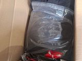 a cardboard box with clothes in it and a pair of scissors in it