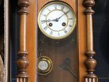 a clock that is sitting on the wall next to a box