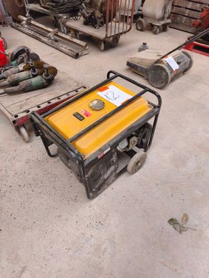 a small generator that is sitting on the floor