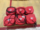 a lot of red fire hydrants sitting on the floor
