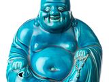 blue buddha figurine sitting on a white surface