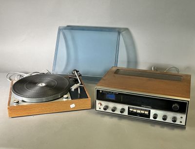 a turntable and a record player sitting on a table