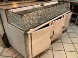 a kitchen that has a stove and a sink in it