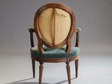 an image of a chair with a wooden frame and green upholstered upholstered seat