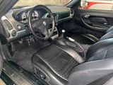a picture of the interior of a car with black leather seats