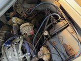 a car engine that is sitting in the trunk of a car