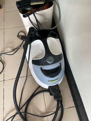 a hair dryer sitting on the floor next to a wall