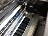 an image of a machine that is printing a piece of paper