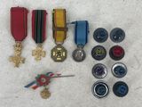 a lot of medals and buttons on the ground