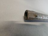 a small metal object that is laying on a table