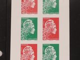 a close up of a stamp with a woman ' s face on it