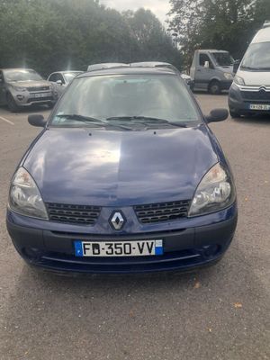 a blue car that is parked in a parking lot