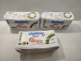 three packages of baby food sitting on top of a white counter