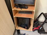 a small cabinet with a television on top of it