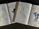 three books with drawings of a woman in a dress and a man in a hat