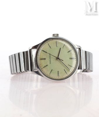 a watch that is sitting on a white surface