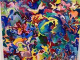 abstract painting of multicolored shapes in a white frame