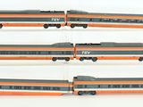 four different views of a model train on display
