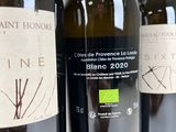 several bottles of wine are lined up on a table