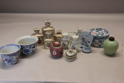 many different types of vases and bowls on the table
