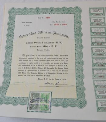 a certificate on a table with stamps on it