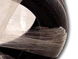 a plastic wrap wrapped around a tire on a white background