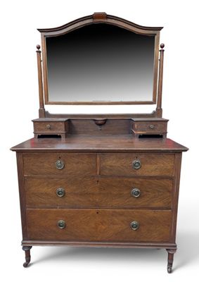 an antique dresser with a mirror on top of it