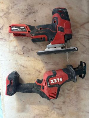 two electric tools sitting on top of a marble counter top