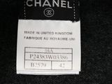 chanel label on a black and white sweater