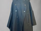 an image of a blue coat on a mannequin stand