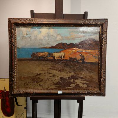 une peinture à l'huile représentant un tableau représentant un troupeau de moutons posé sur un chevalet