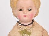 a small doll that is sitting on a table