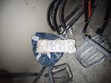 a remote control sitting on top of a pile of tools