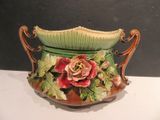 a vase with flowers on it sitting on a table