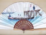 un ventilateur avec un tableau accroché au mur