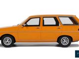 an orange car is parked on a white surface with a blue background