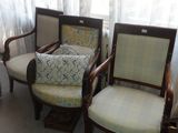 three chairs that are sitting next to each other in a room